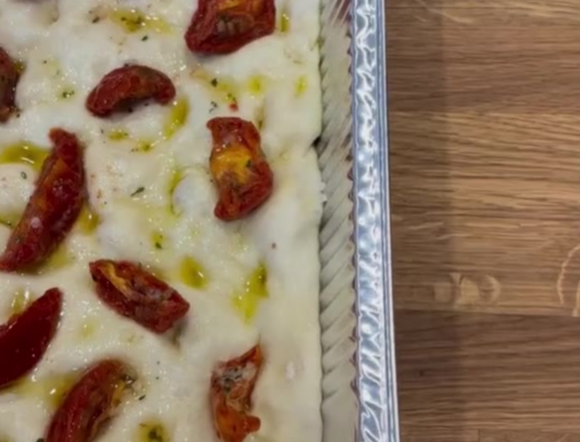 Sourdough focaccia topped with sun-dried tomatoes, oregano and olive oil