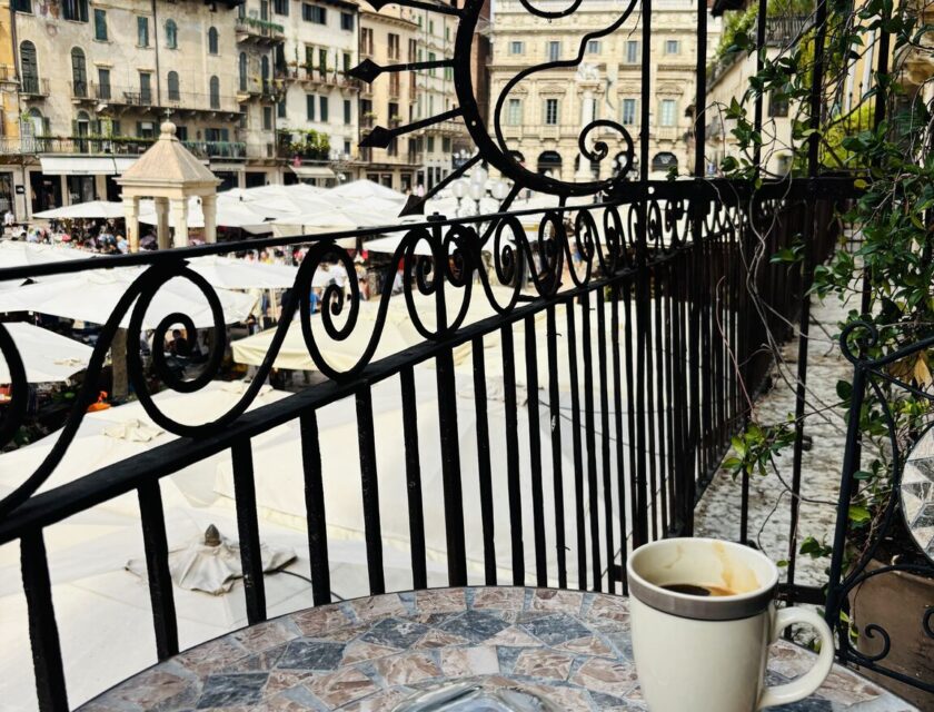 Espresso on a balcony overlooking Piazza delle Erbe in Verona, Italy