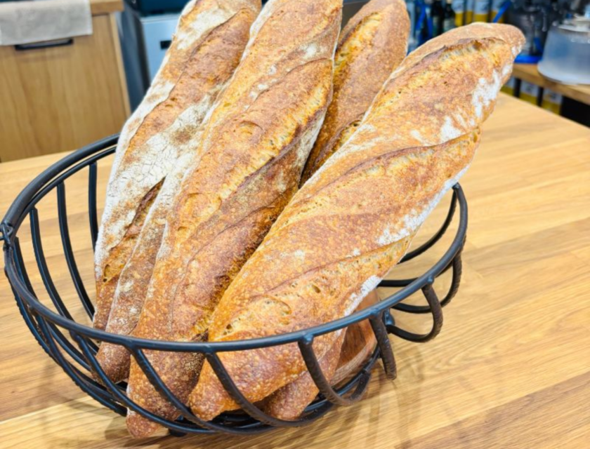 Sourdough baguettes in a basket at the Fussnegger Ltd test bakery