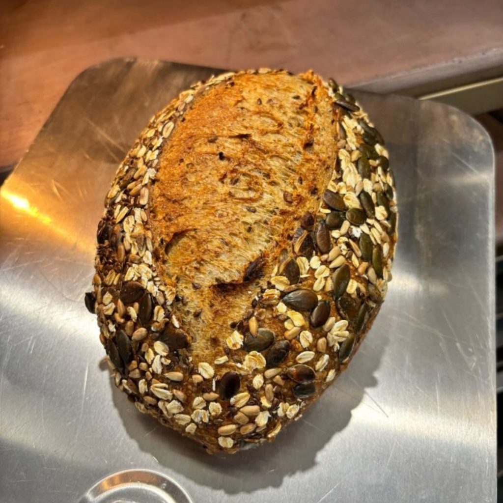 Seeded sourdough loaf baked for the Nightingale House Hospice charity tennis day