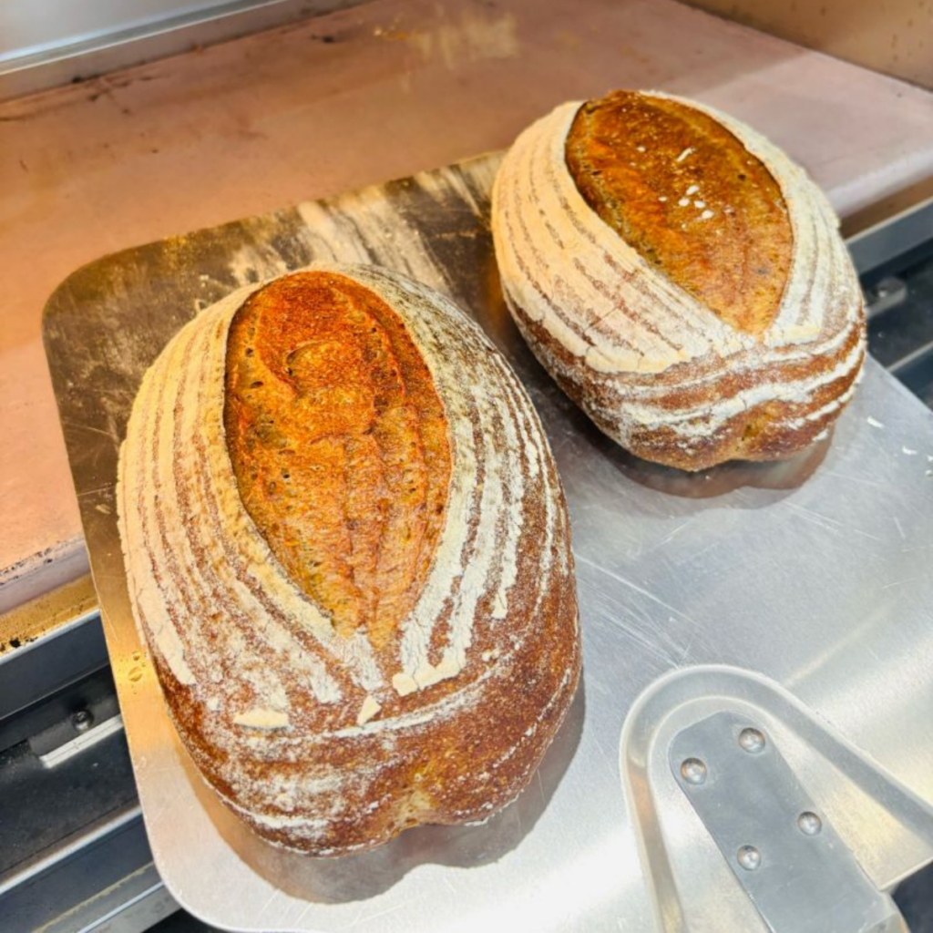 Red Lammas sourdough loaves baking in the deck oven at the Fussnegger Ltd test bakery